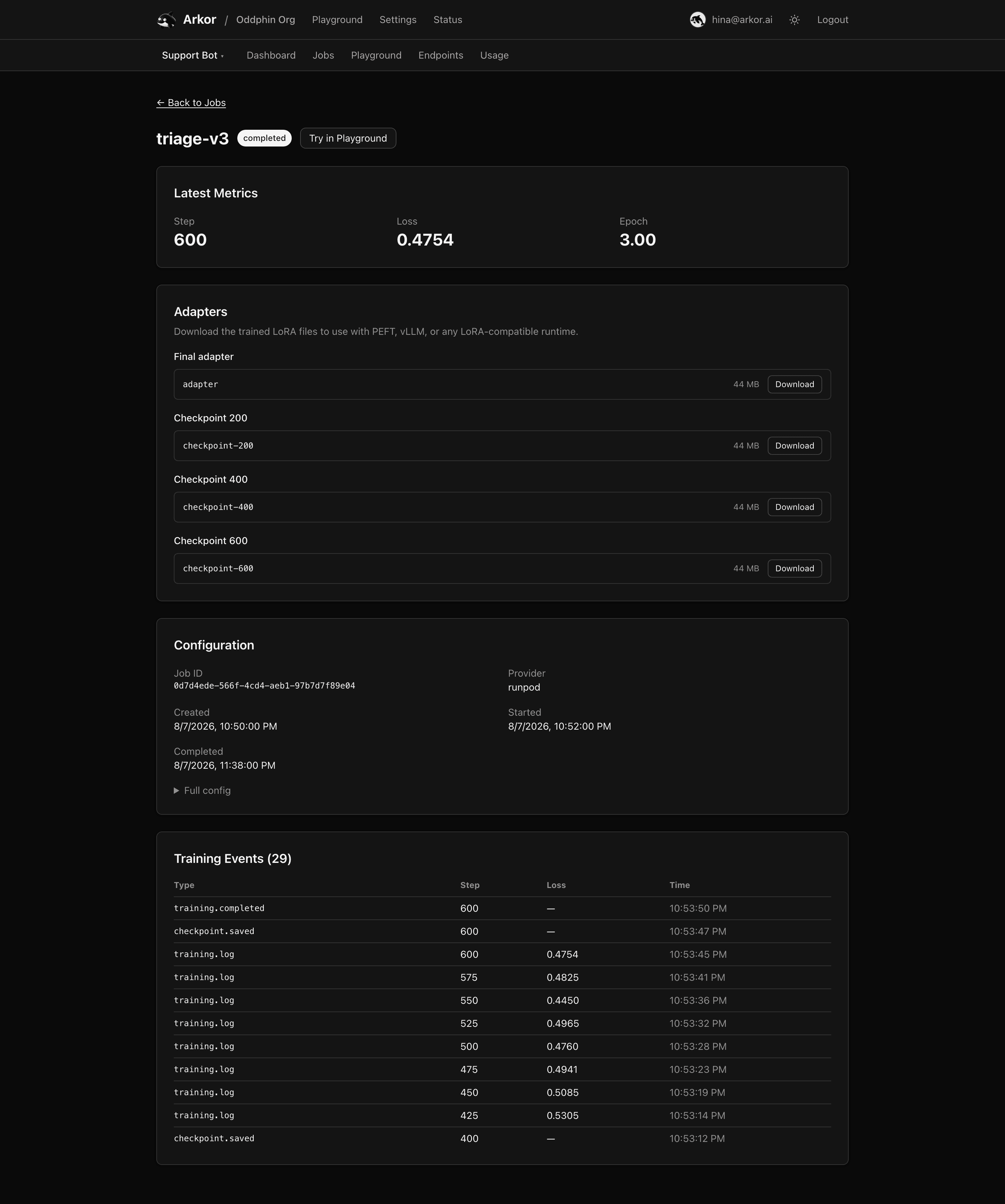 The Adapters section on a completed job, listing the final adapter and each checkpoint with a download link